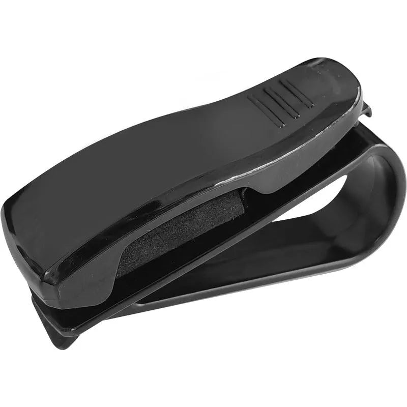 Black plastic car sun visor clip for holding glasses and cards, shown next to a ruler showing 6.5 cm length.