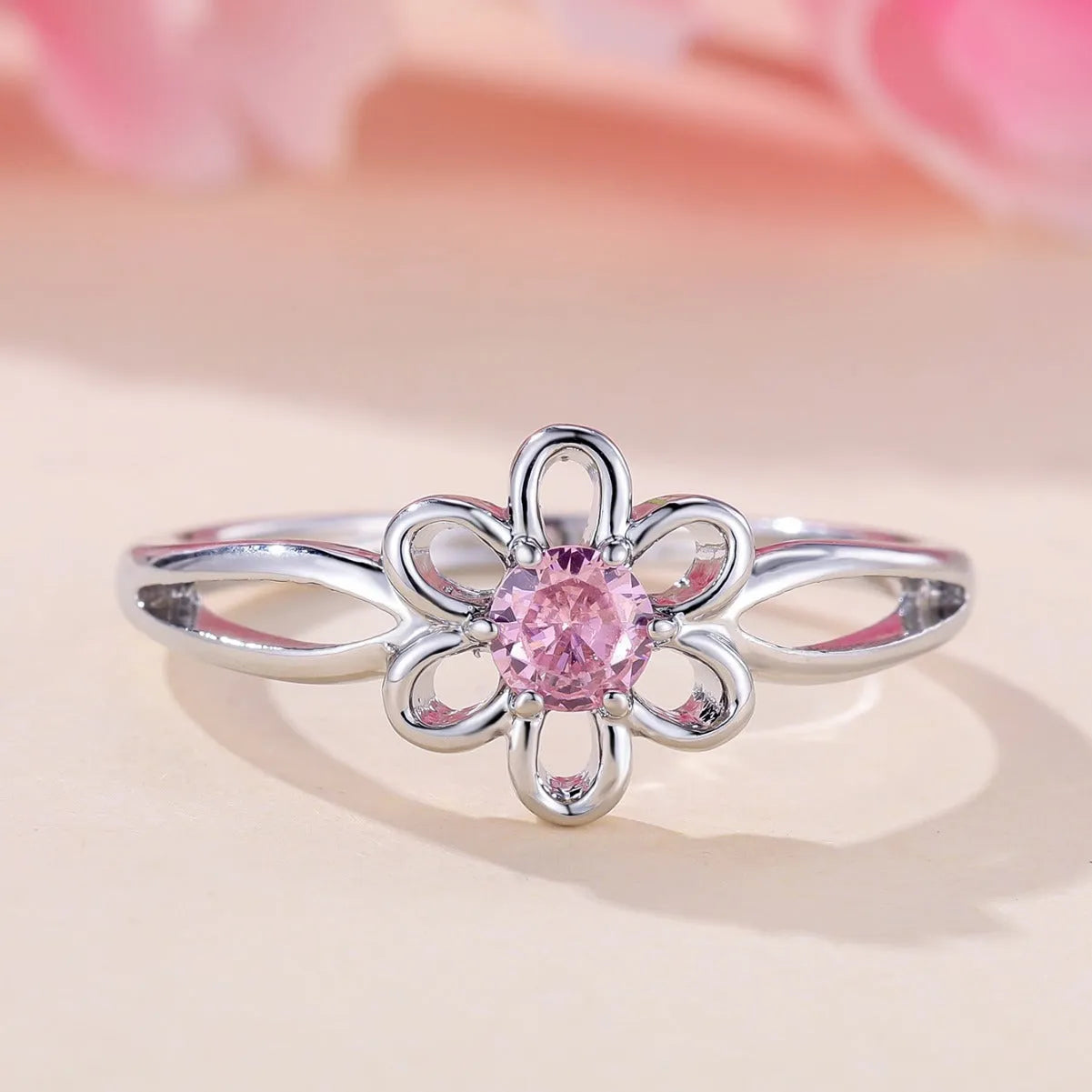 Women's copper ring with hollow floral design in electroplated platinum pink diamond colour