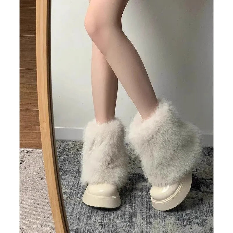 Women's black fleece-lined snow boots with waterproof rubber platform sole