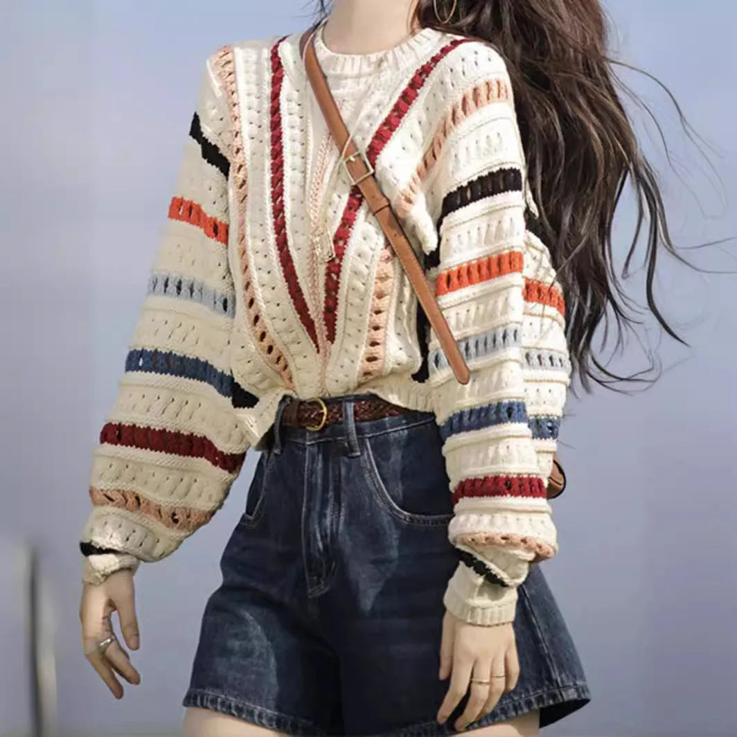 Women's rainbow striped batwing sleeve pullover sweater with a loose fit and round neck.