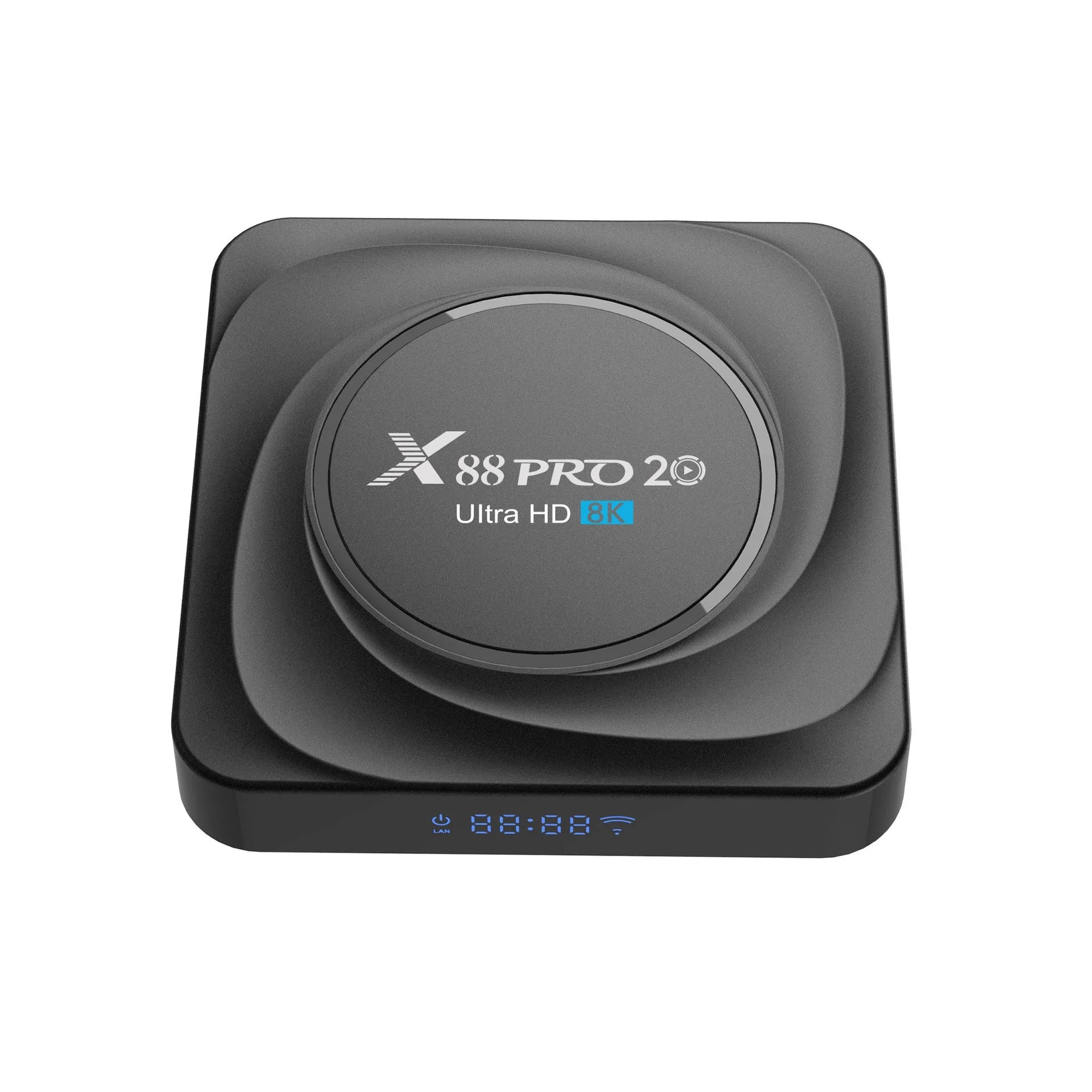 Android 11.0 set-top TV box with remote control and cables on a wooden table.