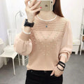 Loose-fit long sleeve round neck women's polyester top in solid colour, available in black, pink, and white.