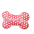 Pet plush chew toy in bone powder colour with teeth cleaning and vocalisation features