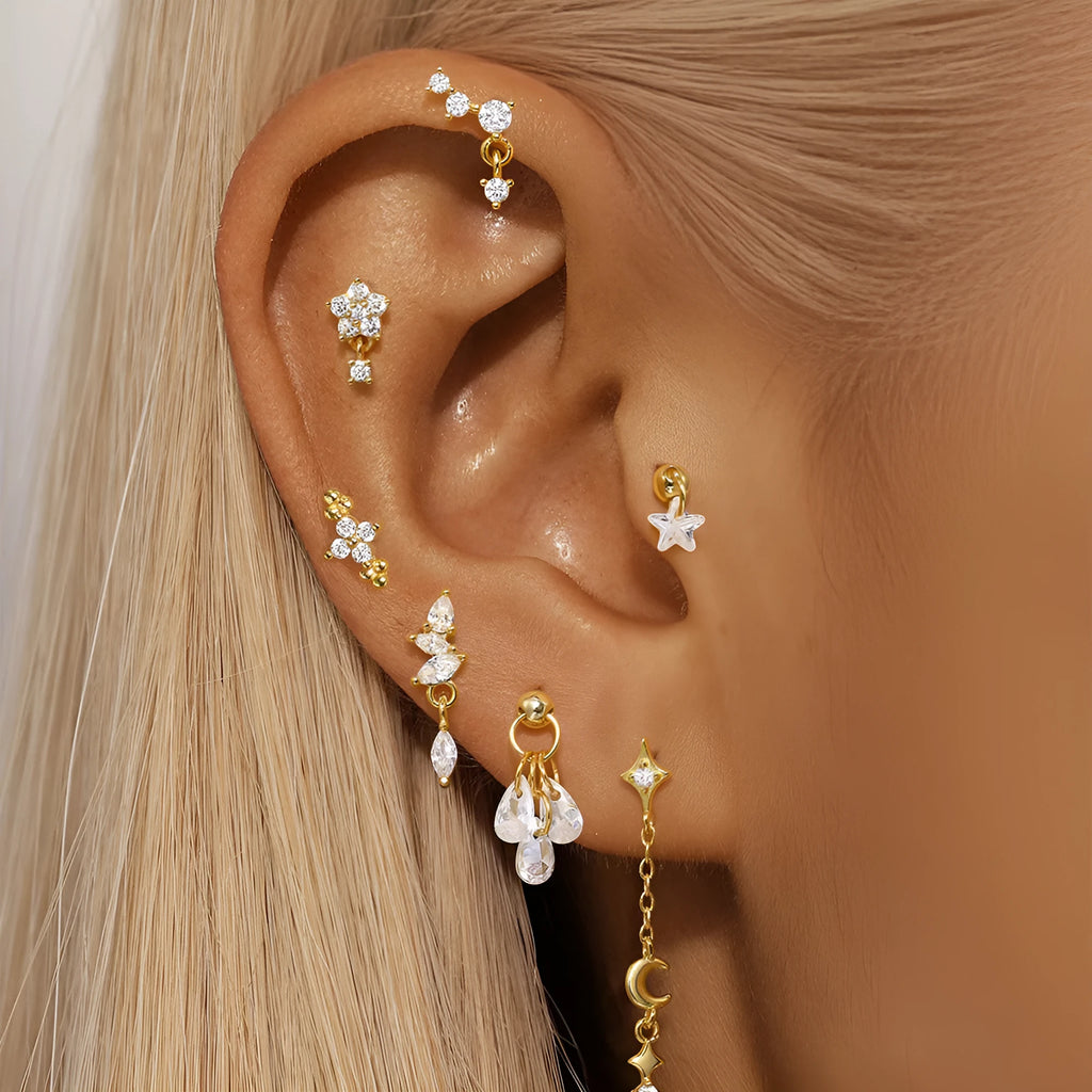Geometric moon and star earrings in S925 sterling silver with embedded diamonds and a gold colour finish.
