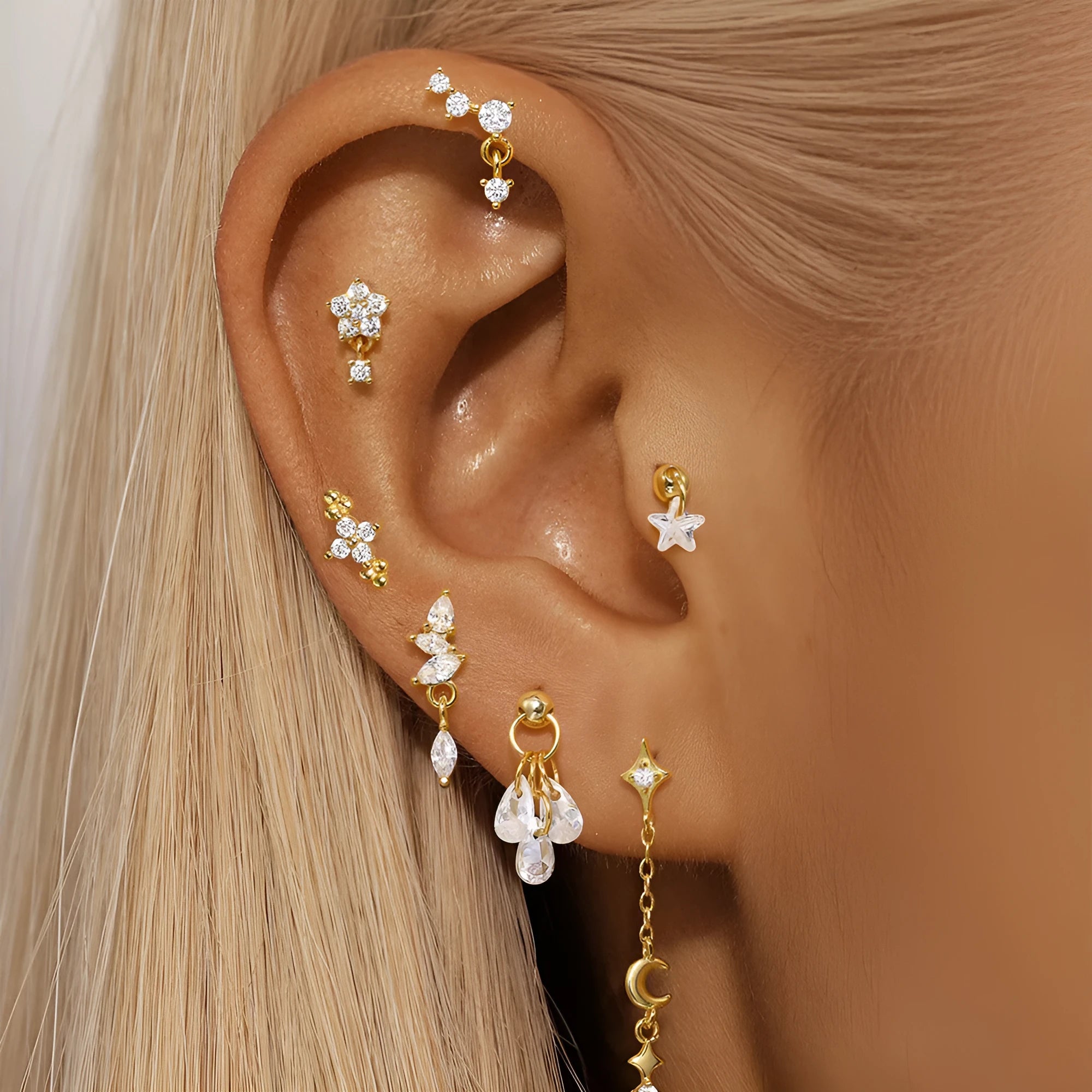 Geometric moon and star earrings in S925 sterling silver with embedded diamonds and a gold colour finish.