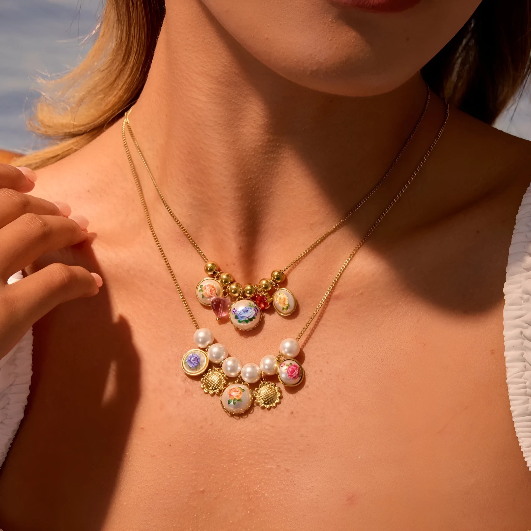 Vintage sunflower stainless steel necklace with 18K gold electroplated finish on display