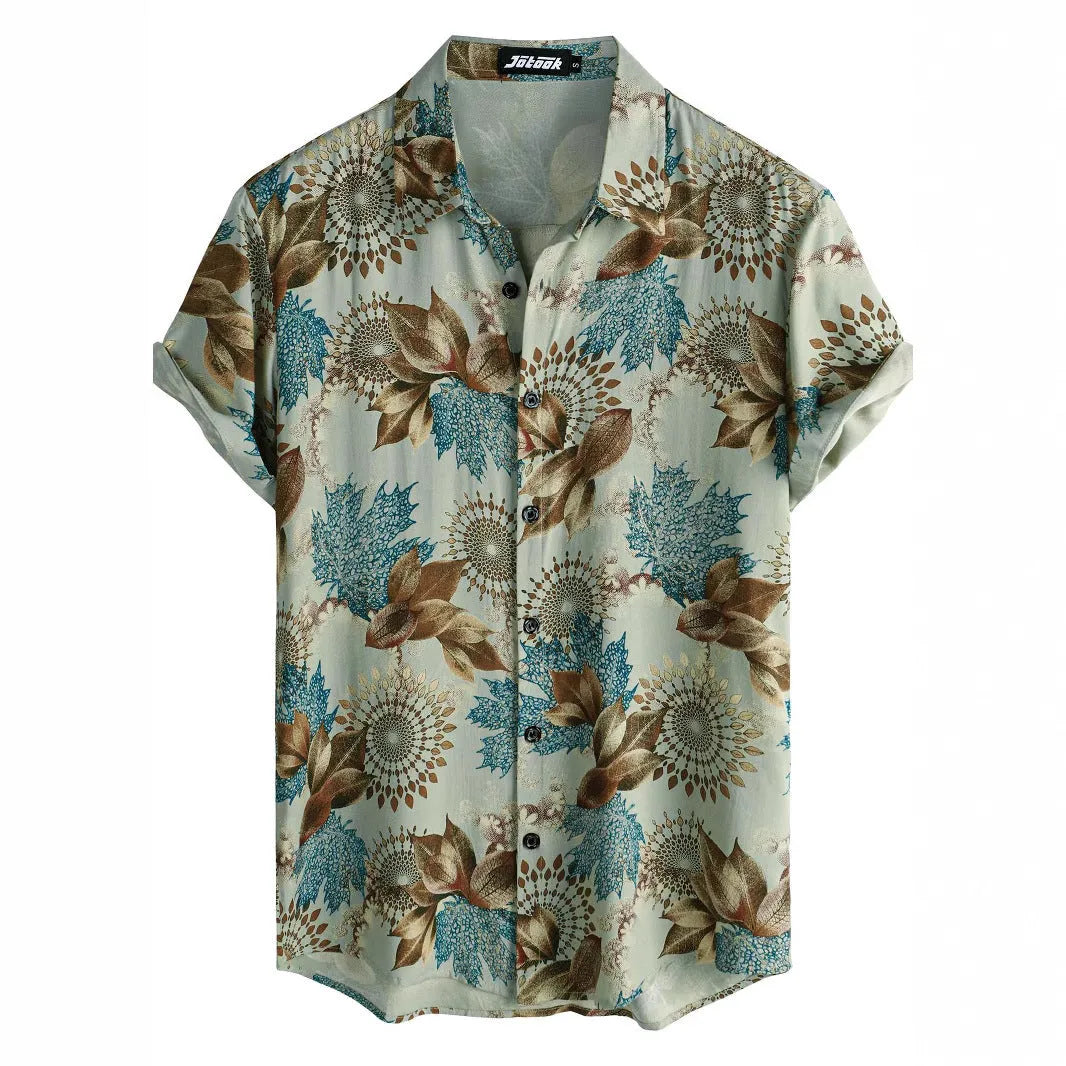 Man wearing a short sleeve Hawaiian shirt with a blue and white floral digital print and a lapel collar.
