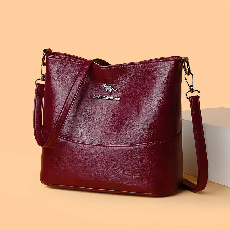 Women's soft leather shoulder bucket bag in black, wine red, or ginger yellow with mobile phone pocket