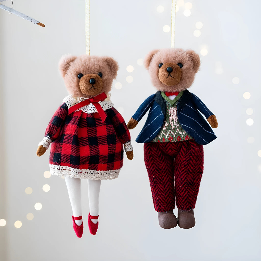 Cartoon plush bear couple, one in a gentleman's suit and one in a princess's plaid dress