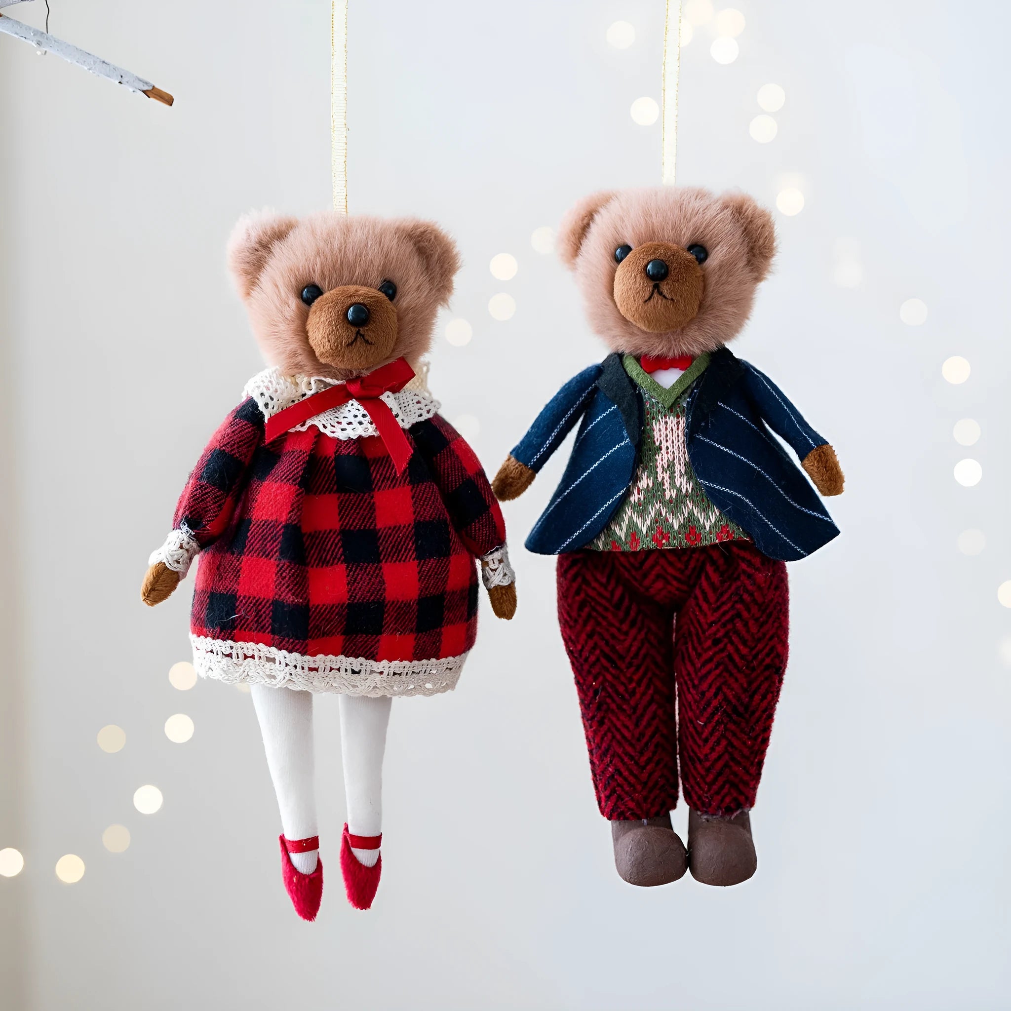 Cartoon plush bear couple, one in a gentleman's suit and one in a princess's plaid dress
