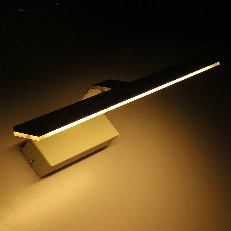 White framed LED illuminated bathroom mirror with integrated lighting mounted above bathroom basin