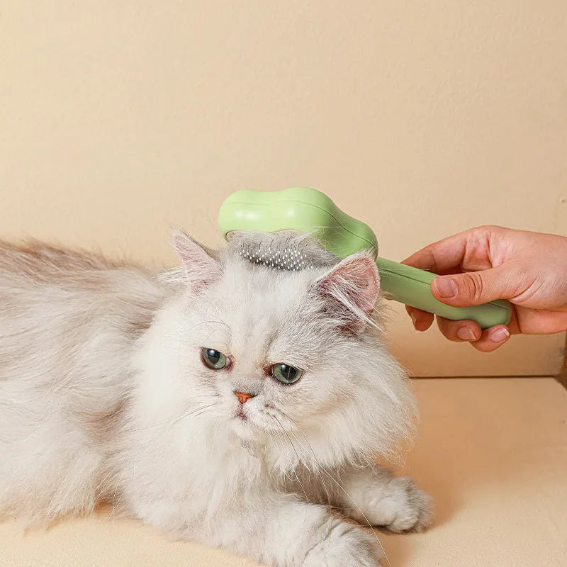 Green stainless steel cat grooming comb with self-cleaning mechanism and four rows of needles