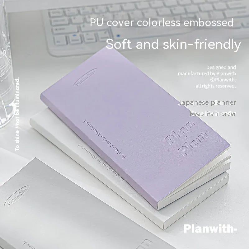 Embossed simple visual daily meter book in blue, showing prefect binding and white paper interior.