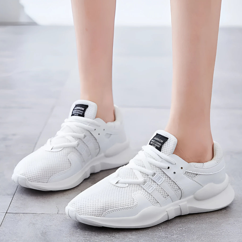 Breathable hollow mesh sneakers in black and white colours with round toe design