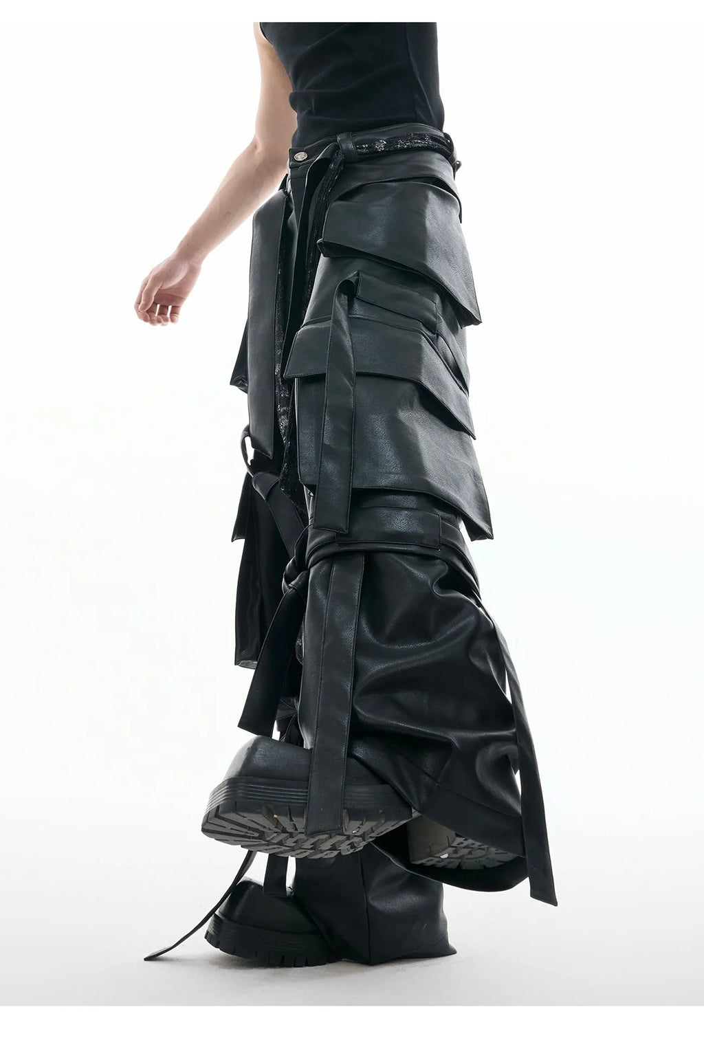 Black retro-style loose-fit trousers with multiple pockets, heavy stitching, and ribbon detail on a hanger.