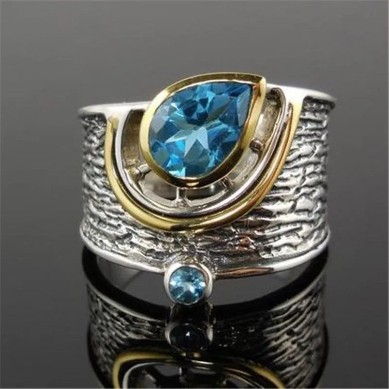 Blue Chinese style drop shape ring with rhinestone zircon inlay on alloy band showing women's jewellery