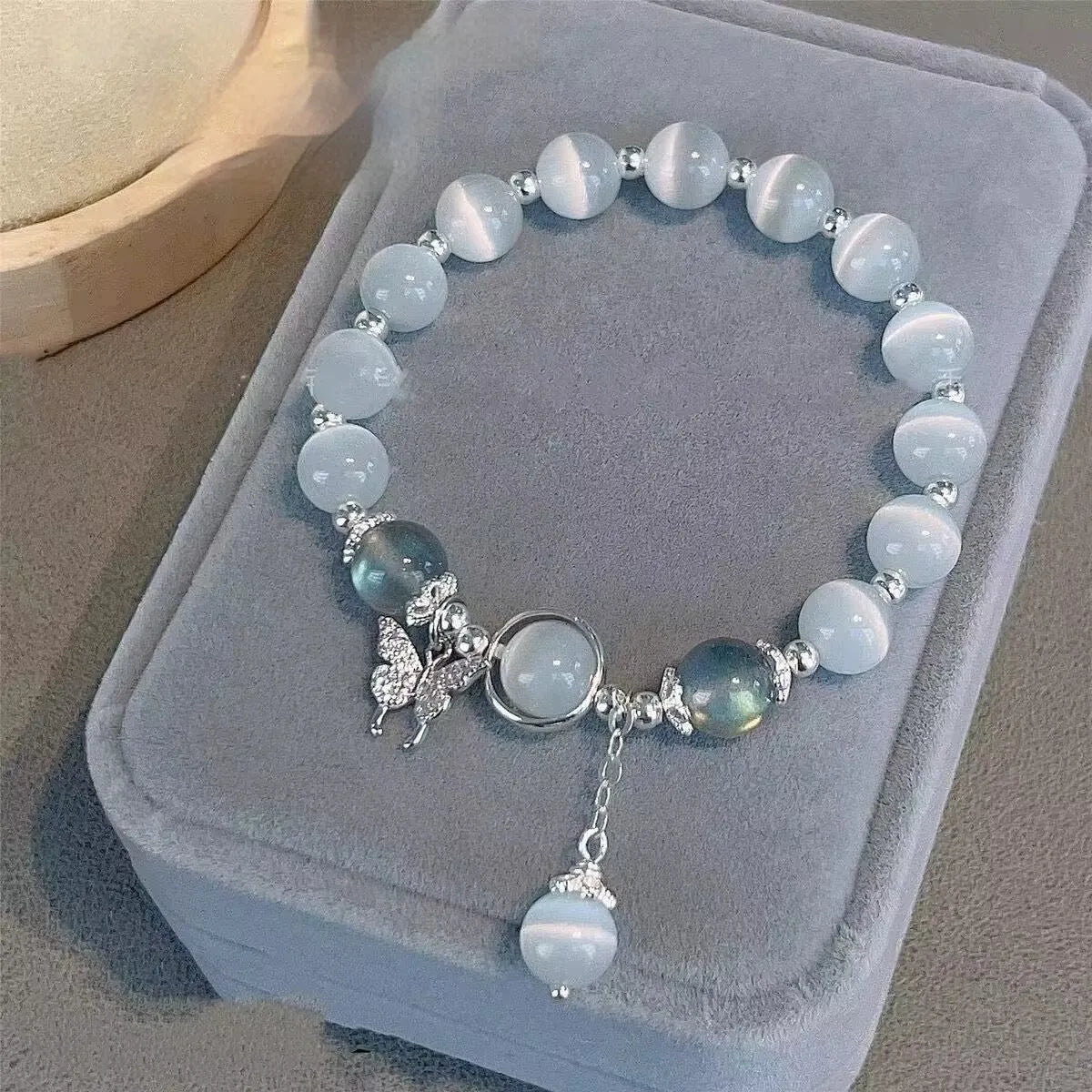 Glass bracelet with butterfly design and blessing card beads in moonlight colours