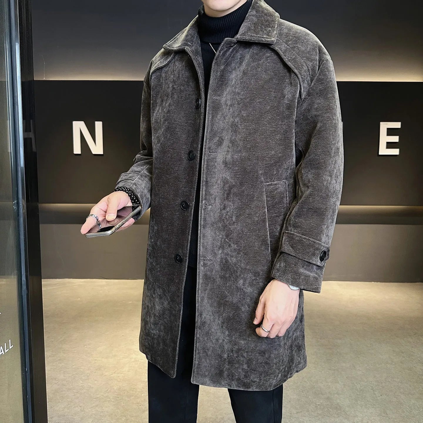 Long brown cotton wool blend jacket with thickened windproof construction, regular fit, and polyester lining, shown front view.