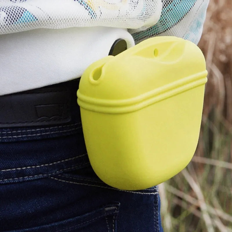 Silicone dog training treat pouch with belt clip and magnetic closure, shown in assorted colours.