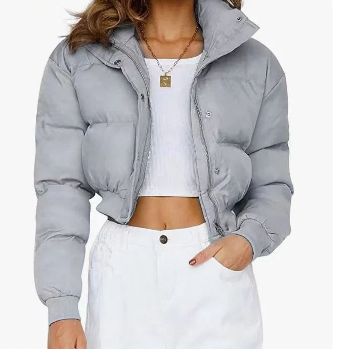 Women's loose blue polyester casual jacket with long sleeves on a hanger