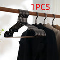 Elegant black modern simple clothes hanger for non-slip anti-rust garment organisation.