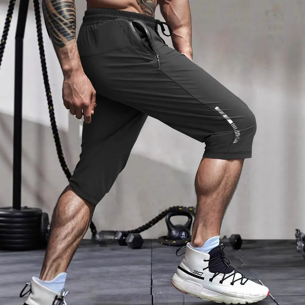 Men's cropped ice silk sports casual pants in quick-drying nylon, shown in blue colour