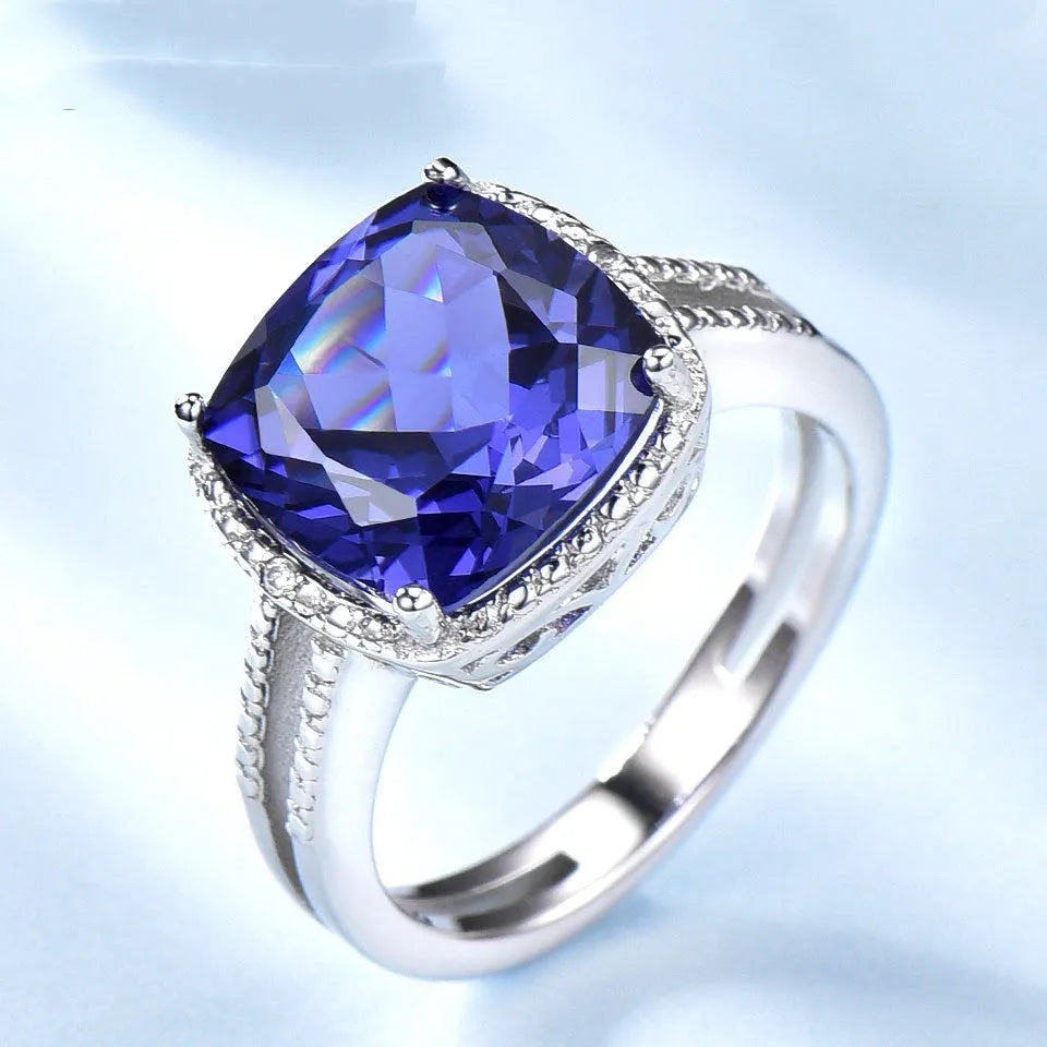 Women's sterling silver ring with blue tanzanite stone showing band detail