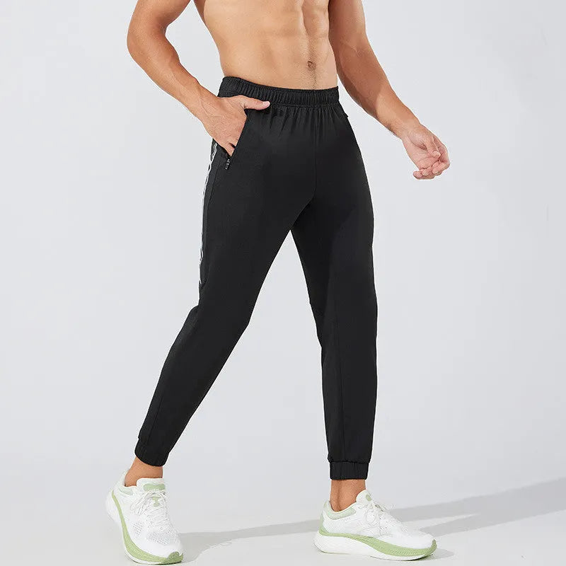 Men's black running trousers with mid waist fit and breathable polyester construction