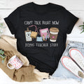 Black cotton loose fit T-shirt with short sleeves and round neck on hanger