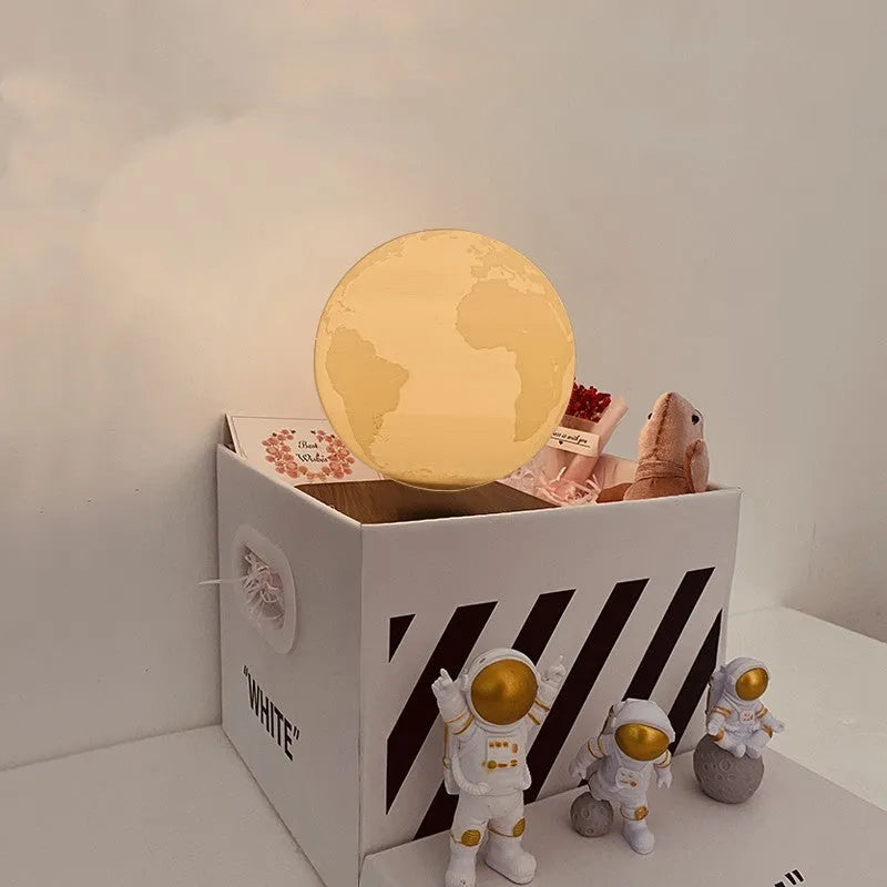 Maglev floating moon night light with LED illumination and astronaut figurines