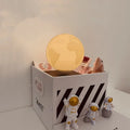 Maglev floating moon night light with LED illumination and astronaut figurines