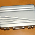 Aluminium alloy metal card holder in red, blue, black, silver, pink, and gold colour options.