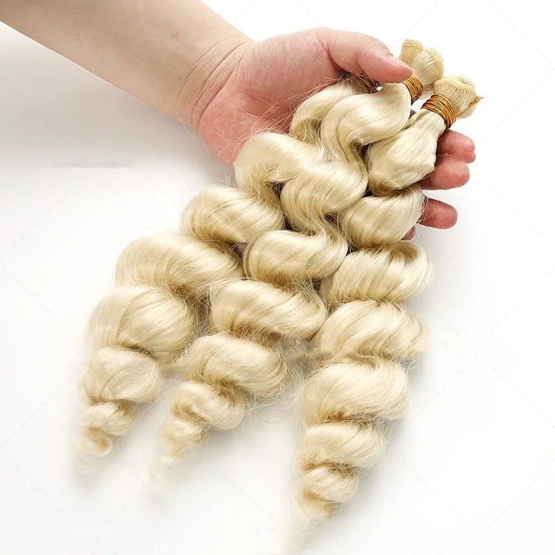 Golden synthetic wig on a stand showing long, straight high-temperature chemical fibre weft.
