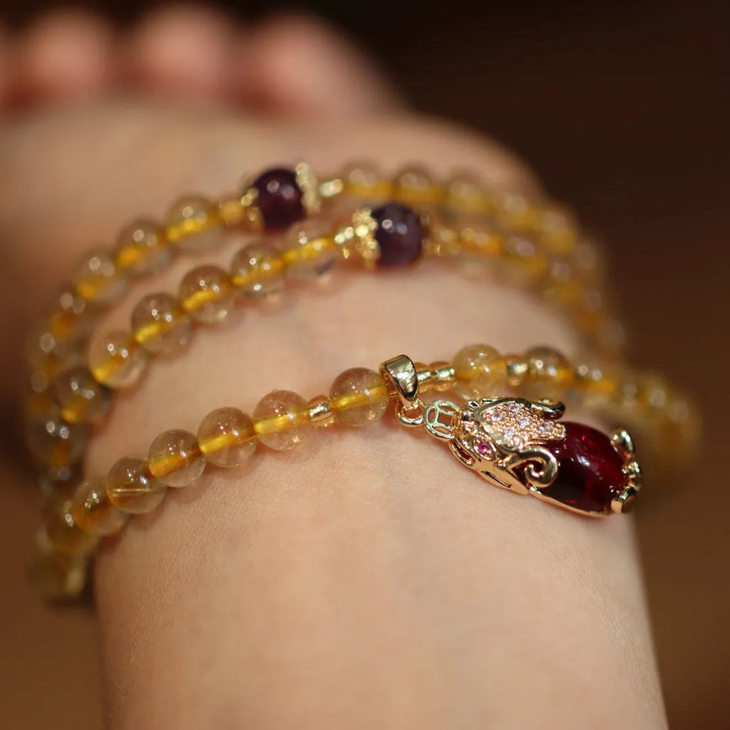Natural Brazil gold rutilated quartz bracelet with three gold circles and ruby quartz charms in Chinese style