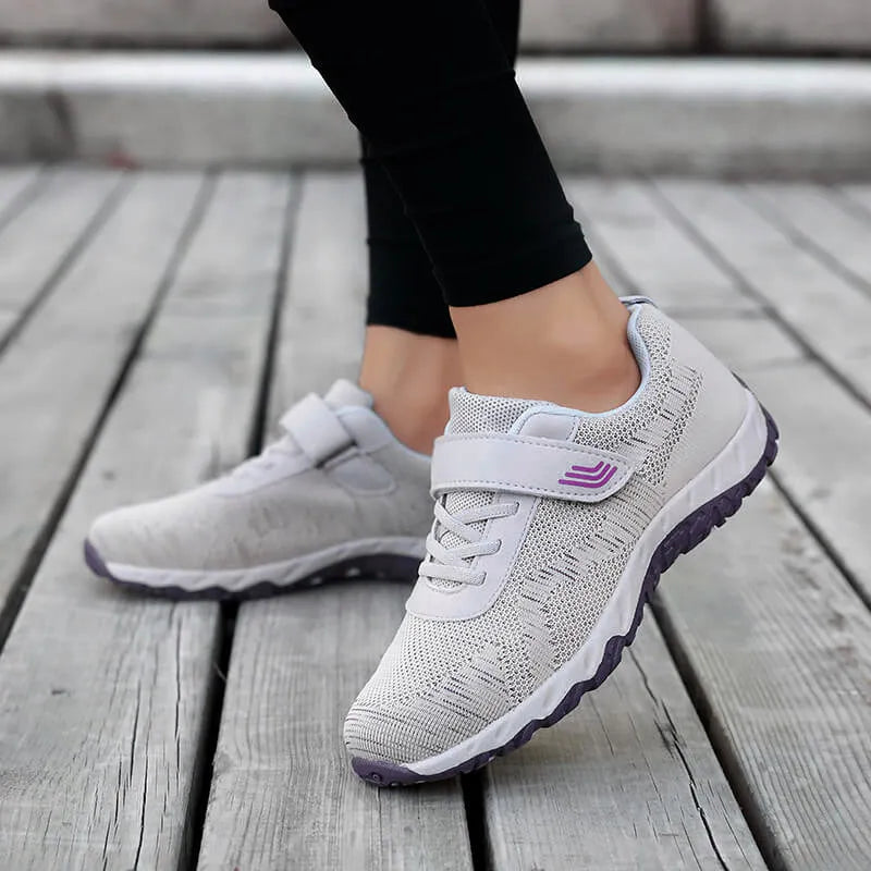 Women's grey purple low-top wedge heel shoes with mesh upper and Velcro strap fastening.