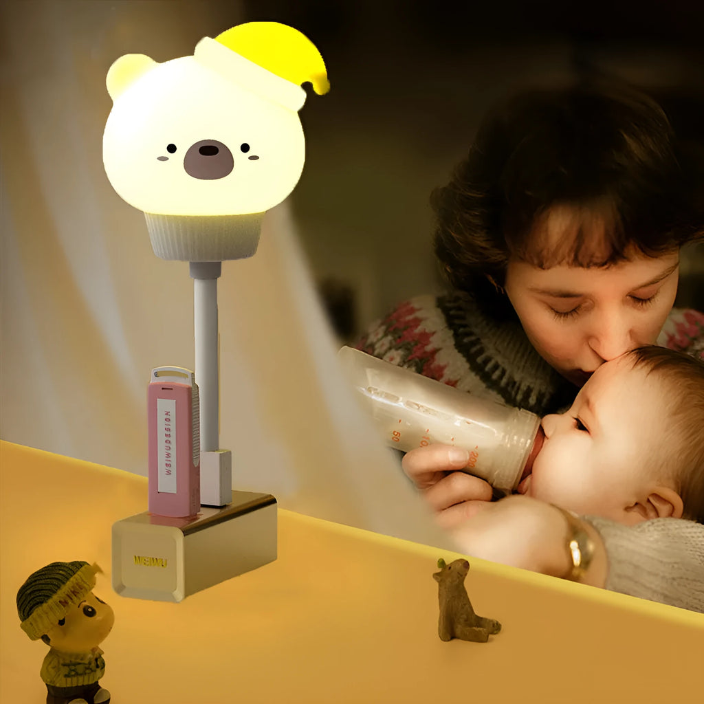 USB portable cartoon animal LED night light with remote control on a bedside table