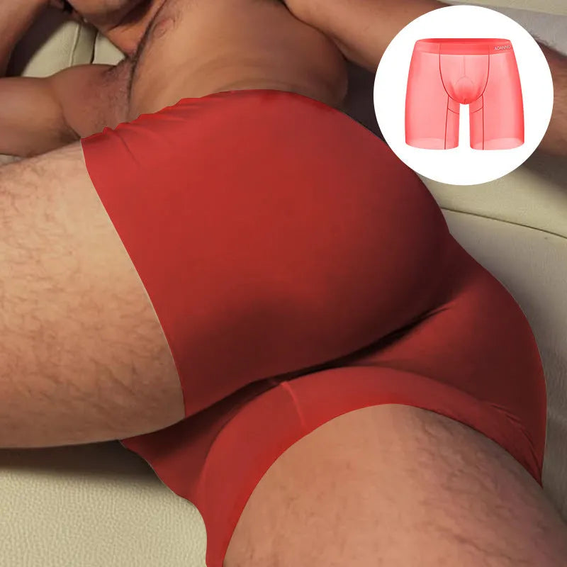 Orange men's seamless low waist boxer shorts made from quick-dry nylon fabric.