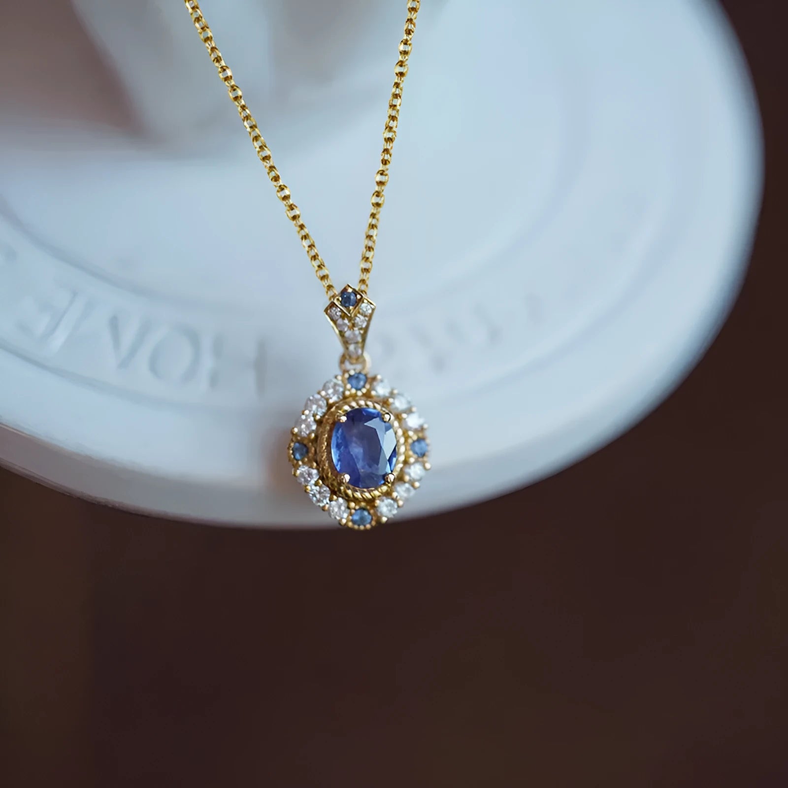 Golden women's necklace with mixed gemstone pendant on adjustable box chain