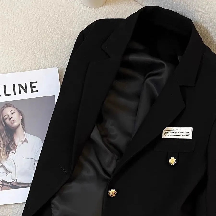 Black short suit coat for women with loose fit, long sleeves and pockets in solid color