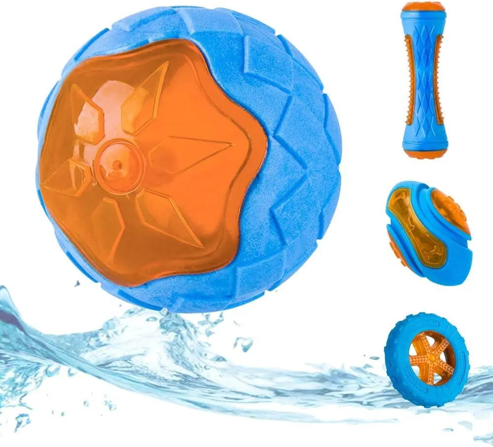 Three floating dog toys: a blue squeaky ball, a red barbell, and an orange tyre on a blue background.
