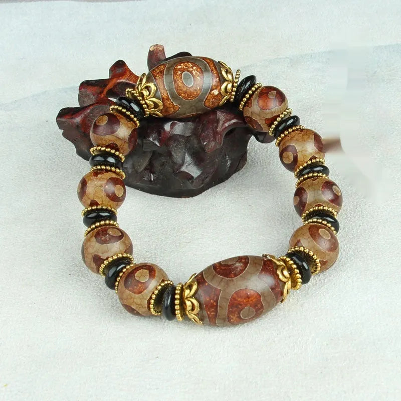 Distressed agate Tibet beads bracelet with three eye dzi design and polished stone beads