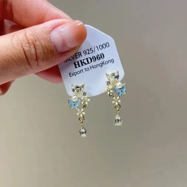 Geometric women's ear clip earrings with rhinestones, heart motifs, star accents, and dangling tassels on alloy with electroplated finish