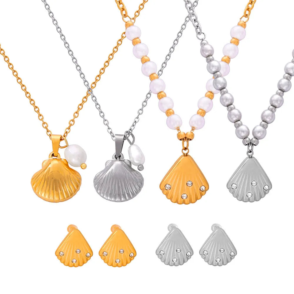 Gold-tone titanium steel necklace with white freshwater pearl beads on an O-shaped chain.