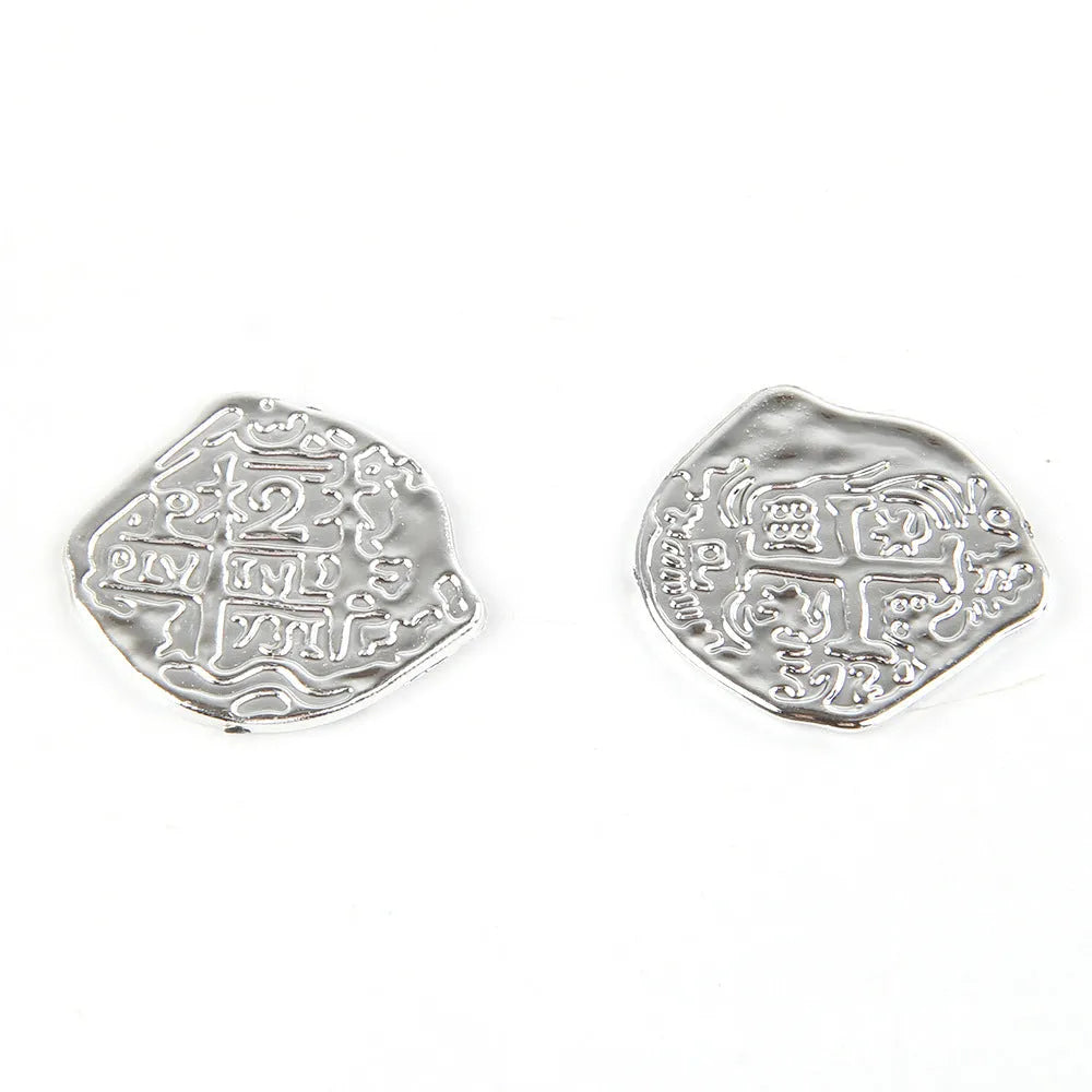 Doli reproduction Roman coins in bronze, gold, and silver electroplated finishes on plastic
