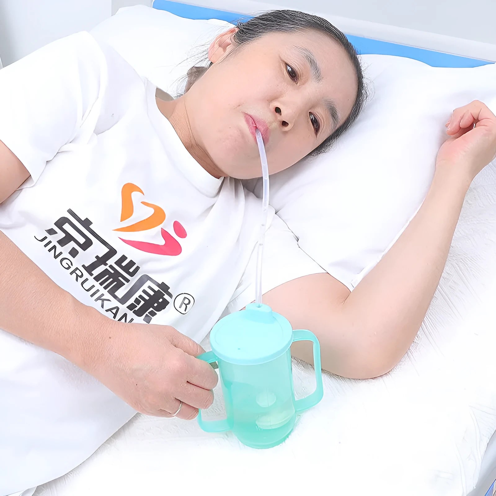 Oblique mouth choke-proof drinking cup for elderly and pregnant users in bed, with optional wrist splint handle.