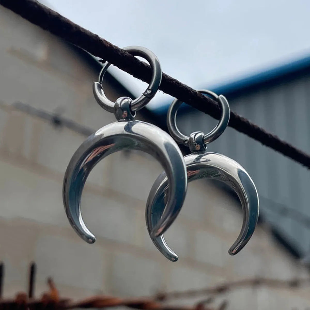 Silver alloy clip-on hoop earrings with gothic moon design and punk style geometric shape