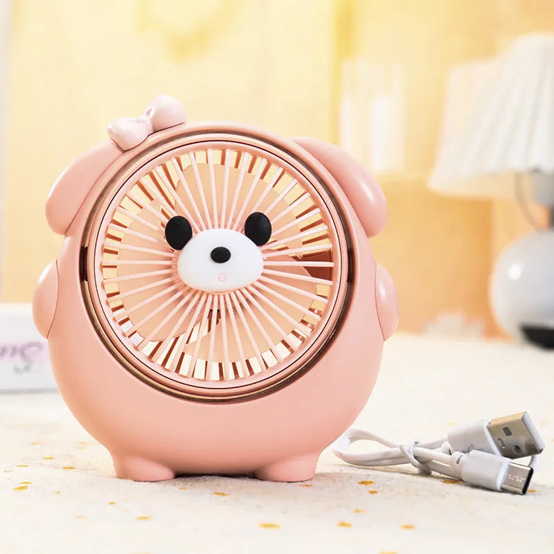 Dog-shaped desktop USB fan showing colour options including brown bear and pink puppy variants