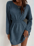 Blue women's knitted dress with hand-crocheted floral details on the front, showing fitted waist and round neck.