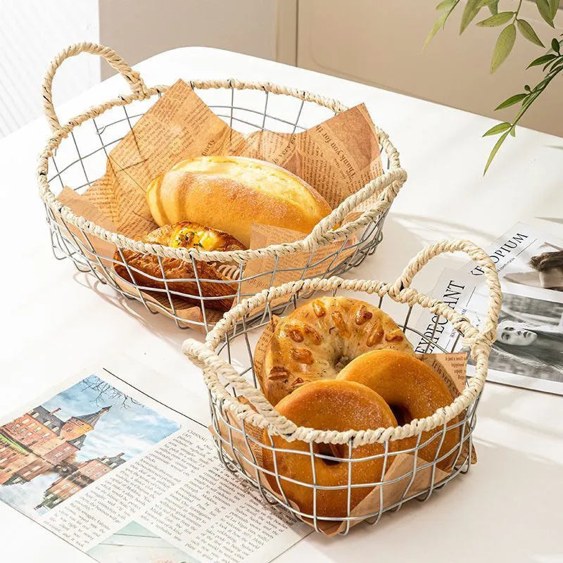 Nordic iron wire woven storage basket in binaural woven style, small size, containing fruit on a kitchen countertop