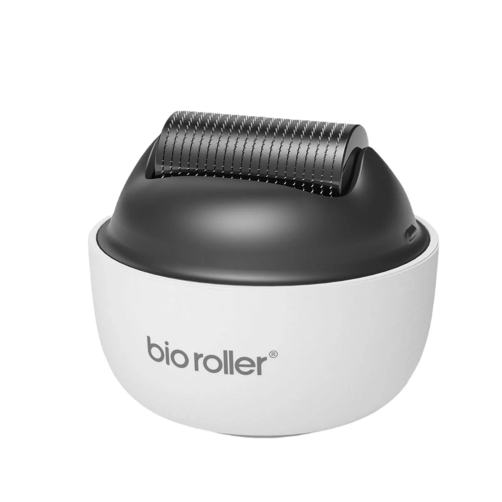 Men's G4 white portable beard derma roller with six microneedle length options on a clean surface
